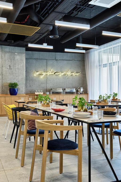 Reštaurácia alebo iné gastronomické zariadenie v ubytovaní Hotel Arche Geologiczna