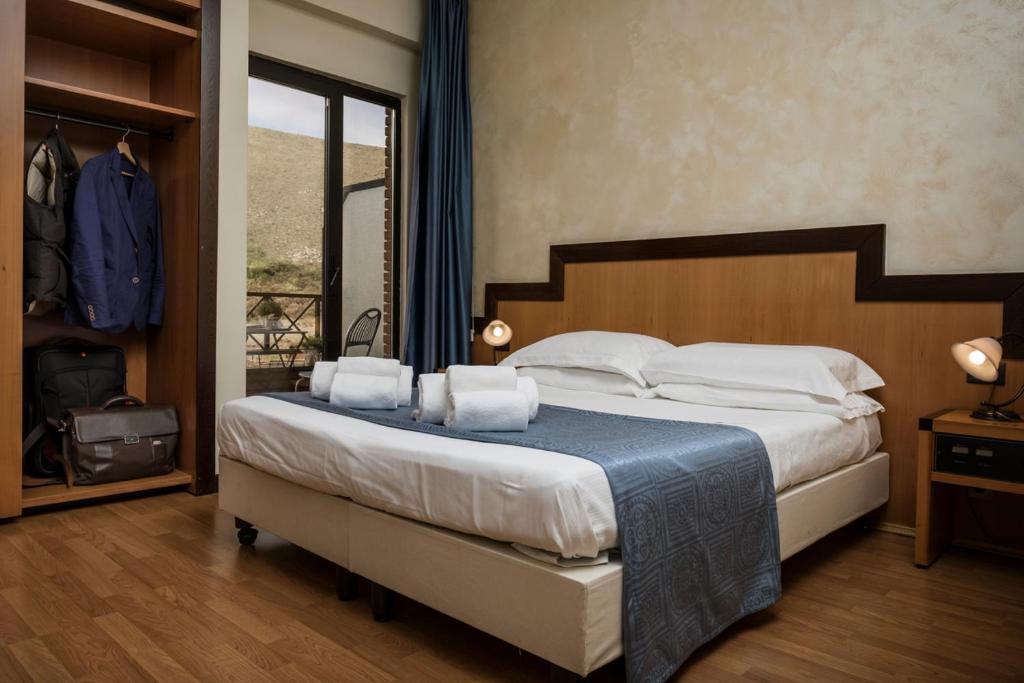 Postel nebo postele na pokoji v ubytování Hotel Olimpia