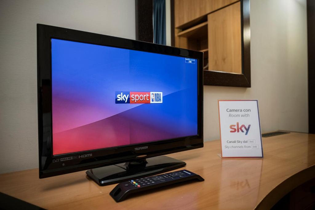 TV a/nebo společenská místnost v ubytování Hotel Olimpia