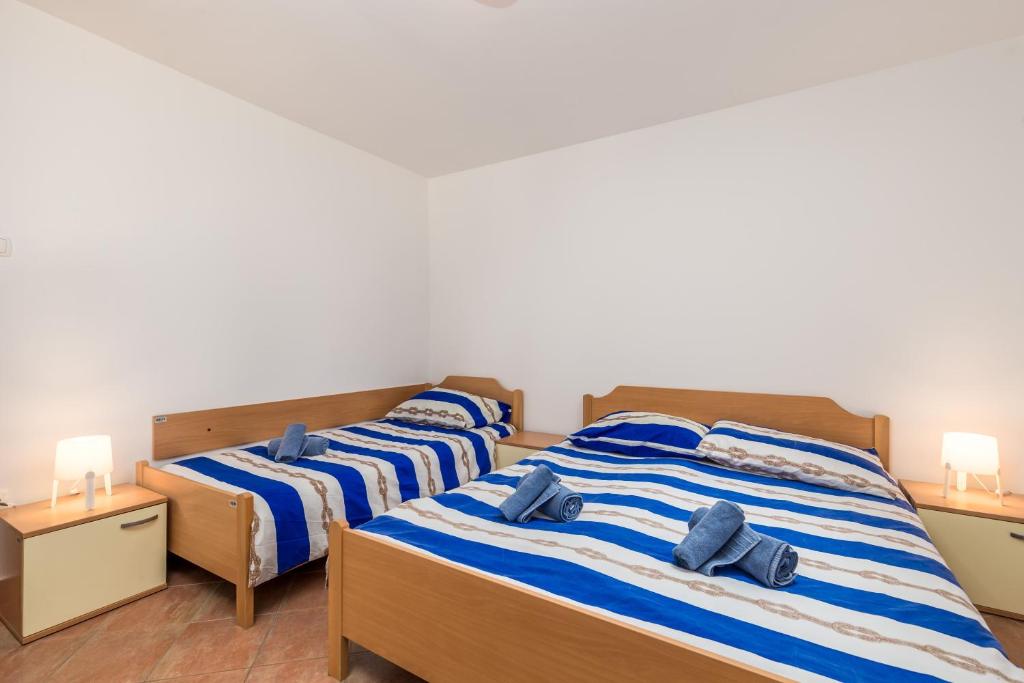 Posteľ alebo postele v izbe v ubytovaní Apartment in pinewood near the sea