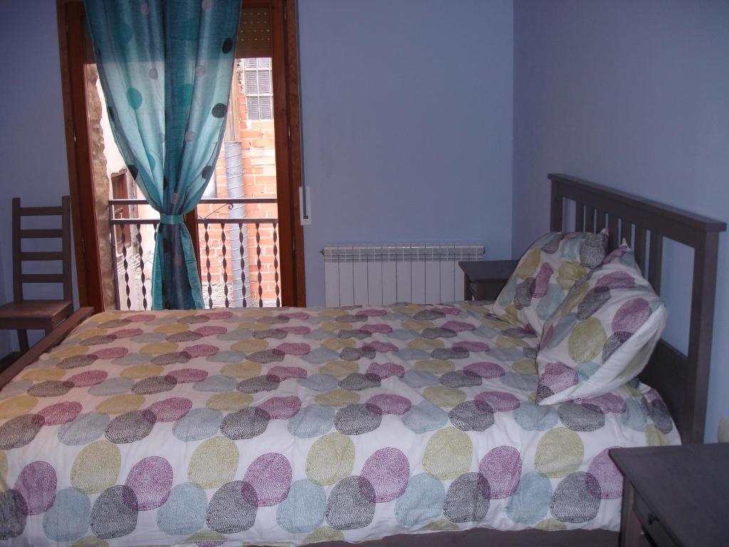 Postel nebo postele na pokoji v ubytování Apartamentos La Muralla