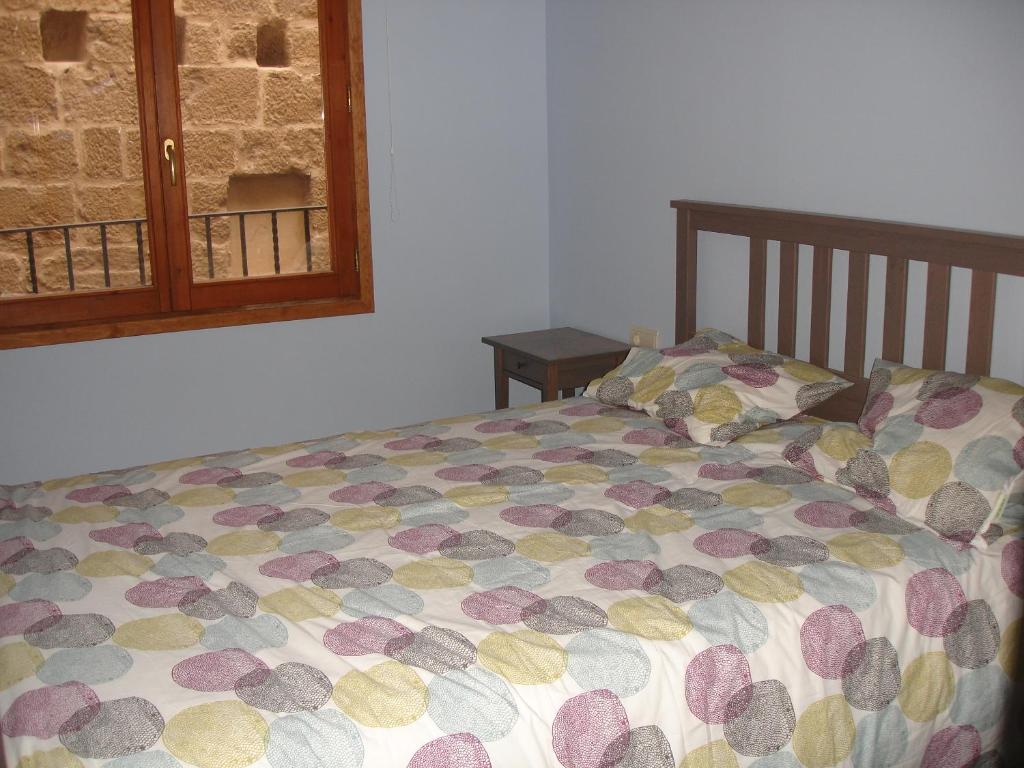 Postel nebo postele na pokoji v ubytování Apartamentos La Muralla