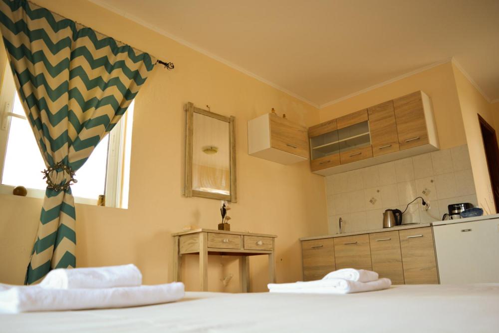 מיטה או מיטות בחדר ב-Tommy's Rooms
