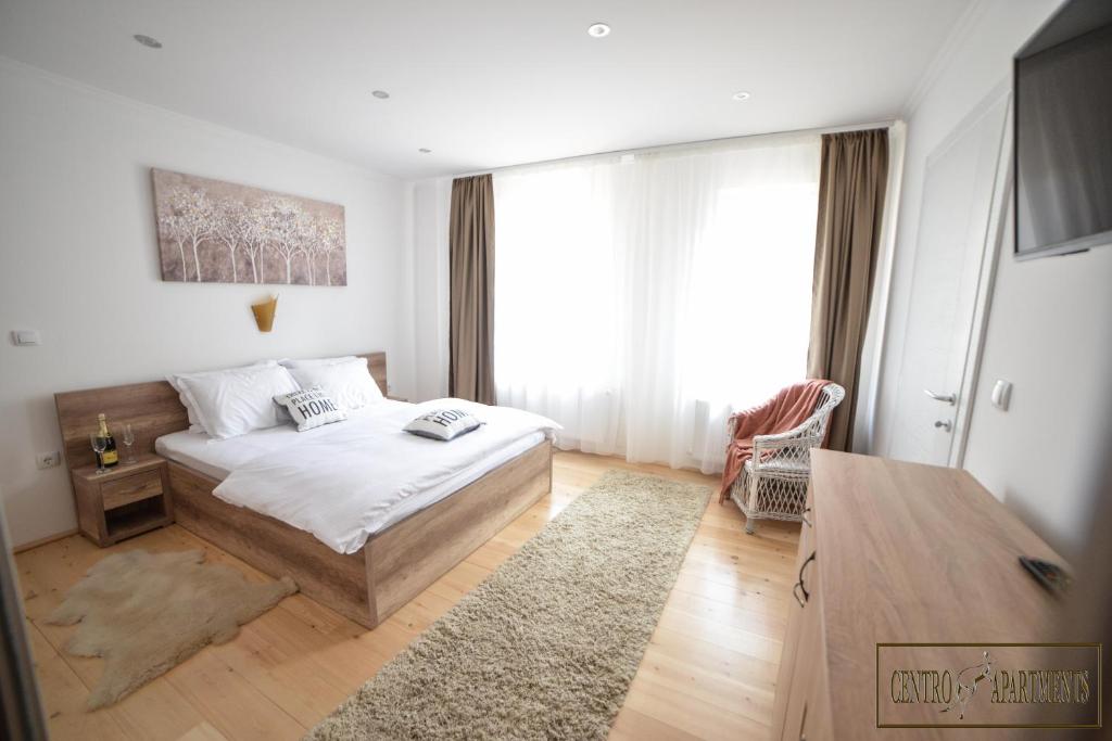 Postel nebo postele na pokoji v ubytování Centro Apartments