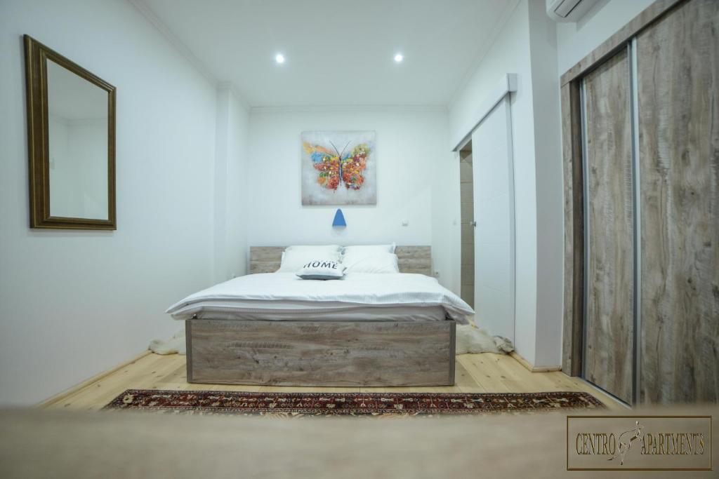 Postel nebo postele na pokoji v ubytování Centro Apartments