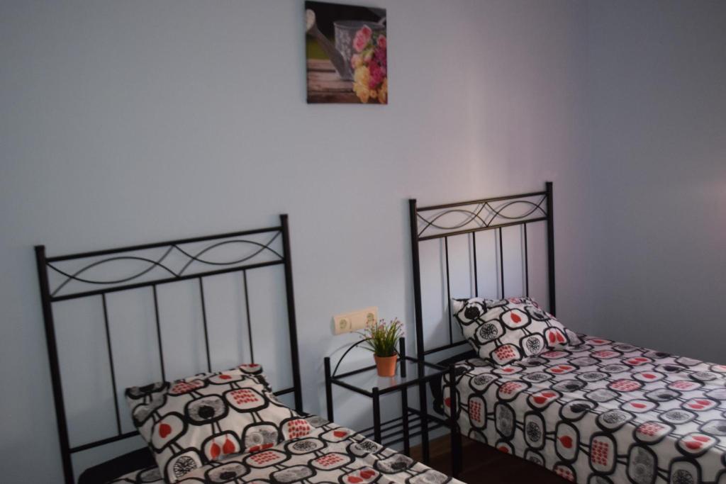 Postel nebo postele na pokoji v ubytování Apartamentos La Muralla