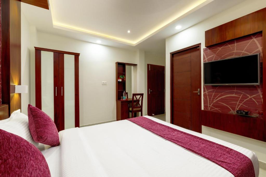 Postel nebo postele na pokoji v ubytování Burooj Hotel