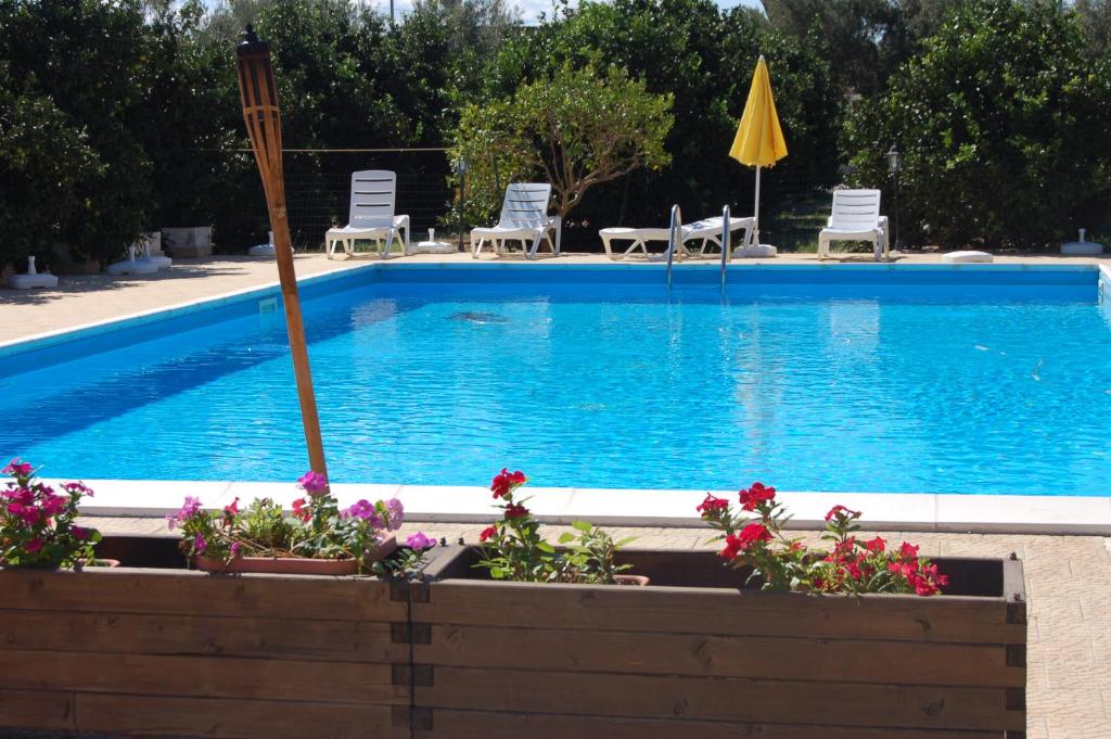 The swimming pool at or close to Il Giardino Del Sole