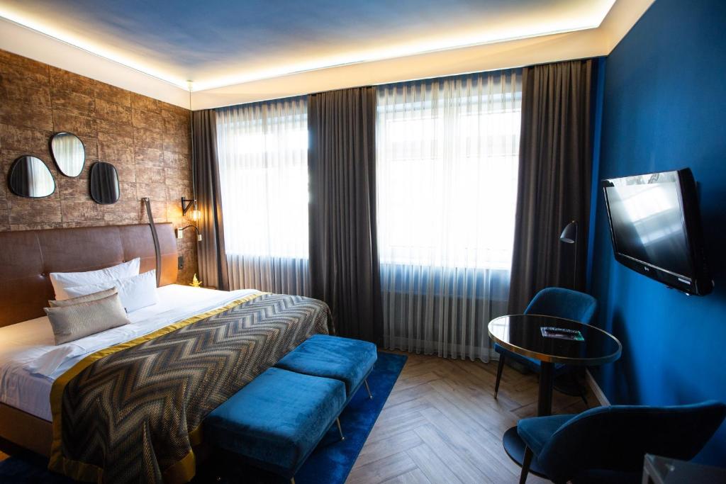 Postel nebo postele na pokoji v ubytování Boutique Hotel Poppenbütteler Hof