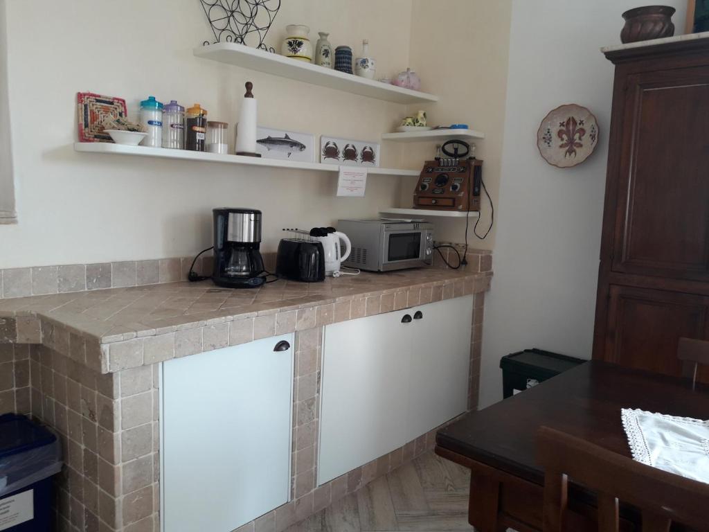 A kitchen or kitchenette at Cà del borgo Historic Village