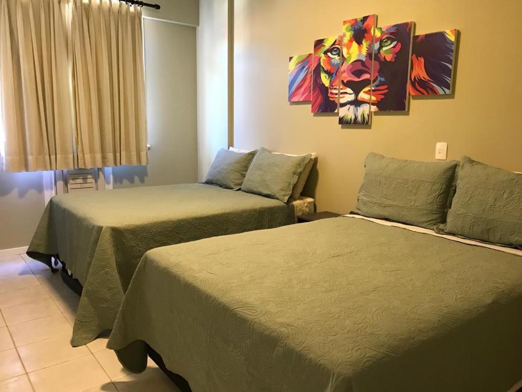 Cama ou camas em um quarto em APT Arraial-150m Prainha, Ar Condicionado e conforto!
