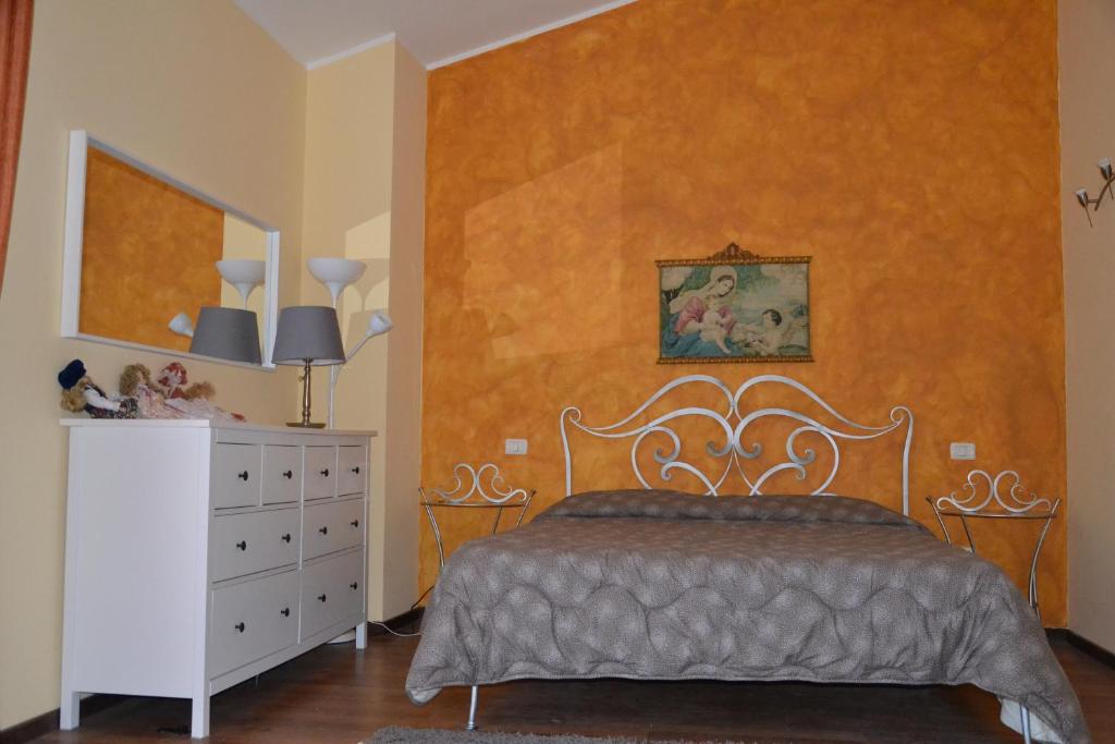 A bed or beds in a room at Casa di Romano