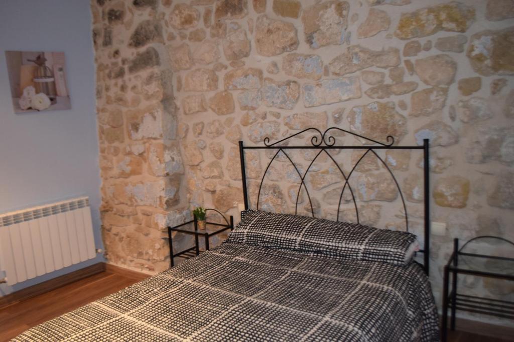 Postel nebo postele na pokoji v ubytování Apartamentos La Muralla