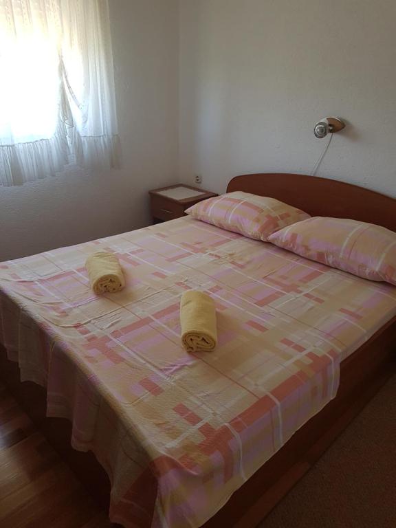 Postel nebo postele na pokoji v ubytování Apartmani Anna