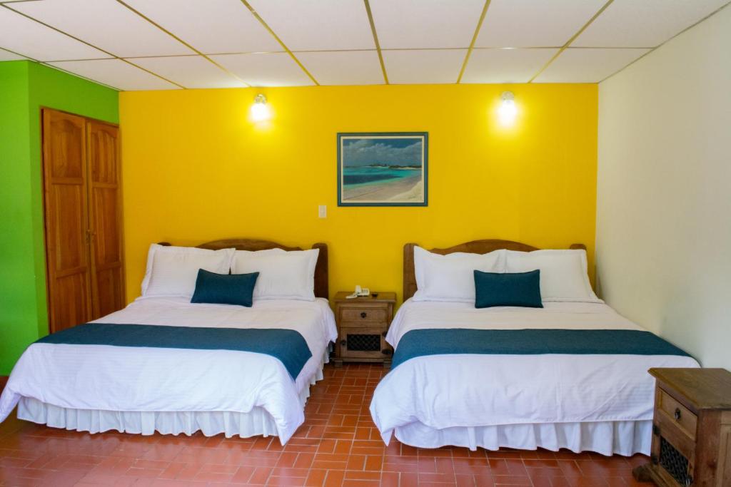 Voodi või voodid majutusasutuse Ecohotel La Casona Pereira toas
