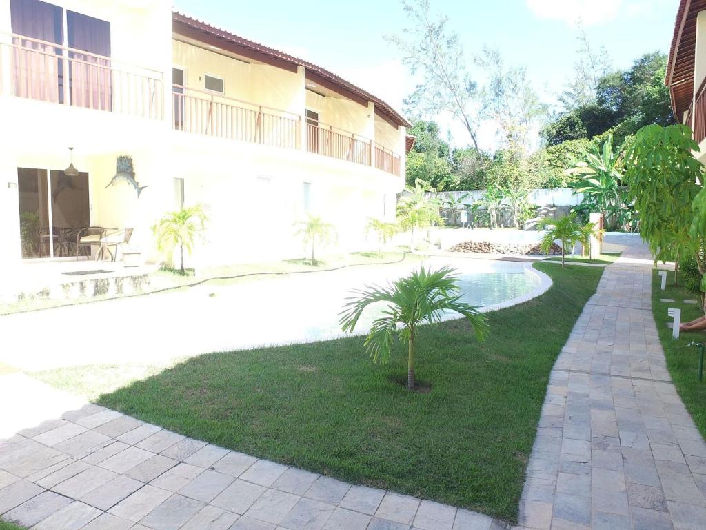  Flat completo e bem localizado no Solar Água Pipa por Carpediem