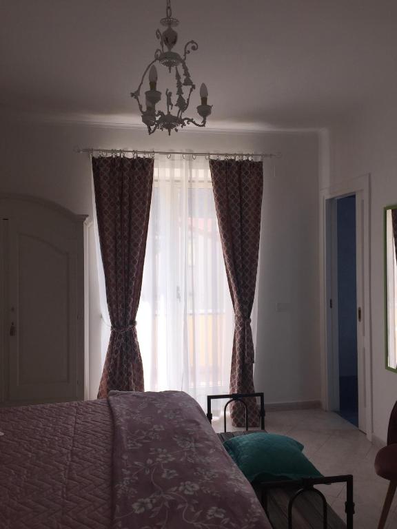 Postel nebo postele na pokoji v ubytování Sorrento Penthouse Suites