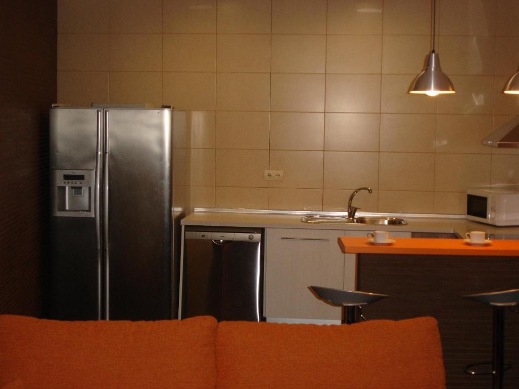 Kuchyň nebo kuchyňský kout v ubytování Apartamentos La Muralla