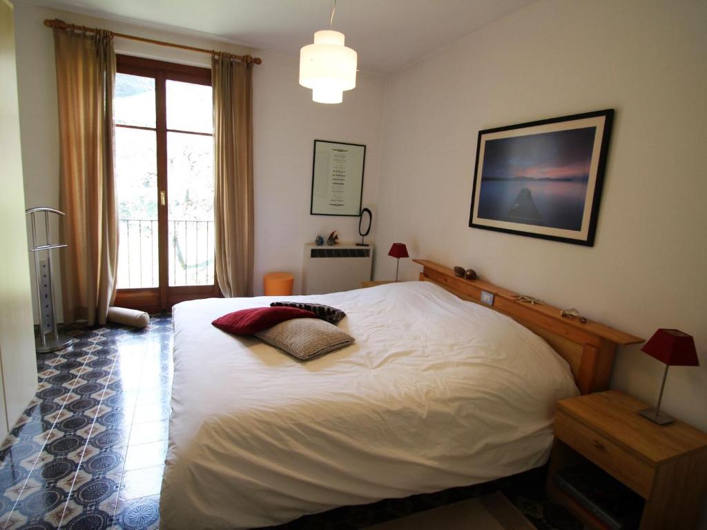 Łóżko lub łóżka w pokoju w obiekcie Apartment Residenza del Pascià by Interhome