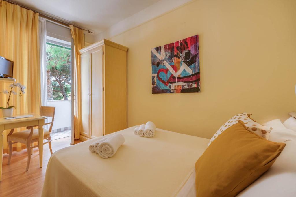 Łóżko lub łóżka w pokoju w obiekcie Hotel Massimo