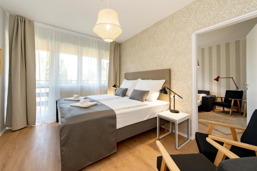 Postel nebo postele na pokoji v ubytování Hotel Forrás Zalakaros