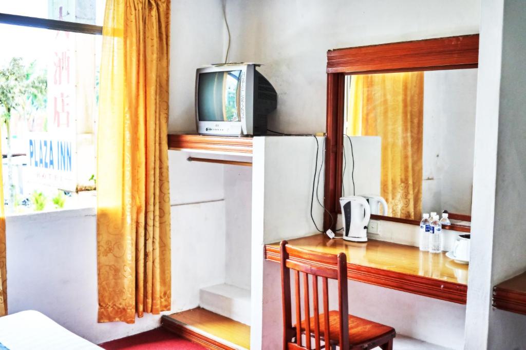 Kuchyň nebo kuchyňský kout v ubytování Plaza Inn