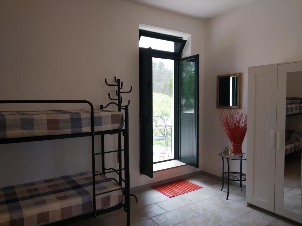 Postel nebo postele na pokoji v ubytování Physis b&b-a casa di Clio
