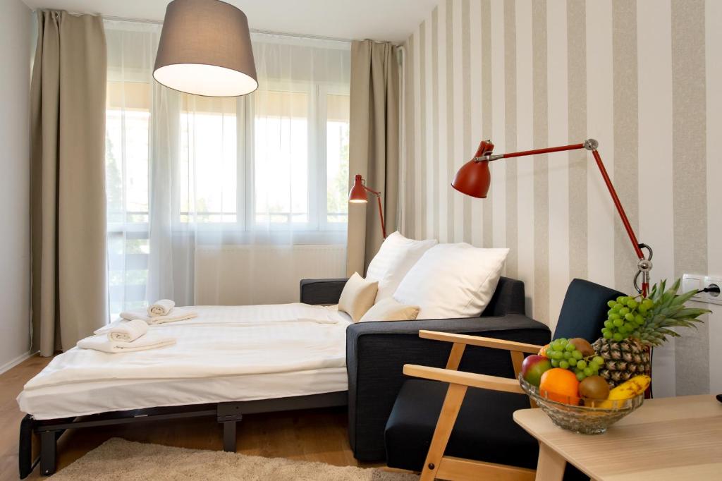Postel nebo postele na pokoji v ubytování Hotel Forrás Zalakaros