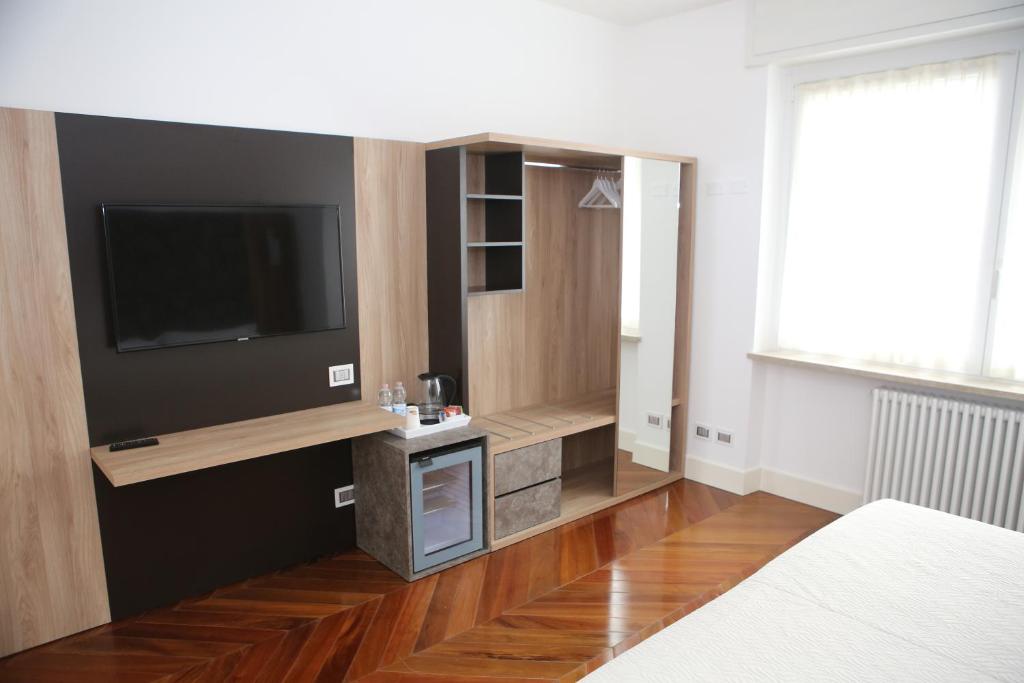 A television and/or entertainment centre at Champagne Rooms