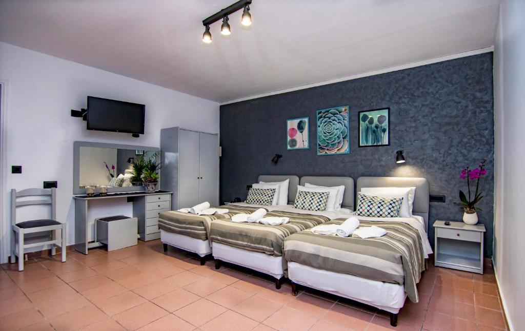 Postel nebo postele na pokoji v ubytování Kahlua Hotel Apartments