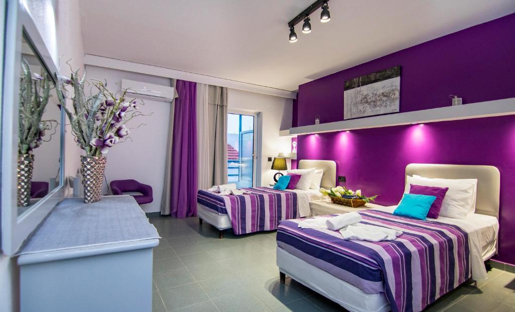 Postel nebo postele na pokoji v ubytování Kahlua Hotel Apartments