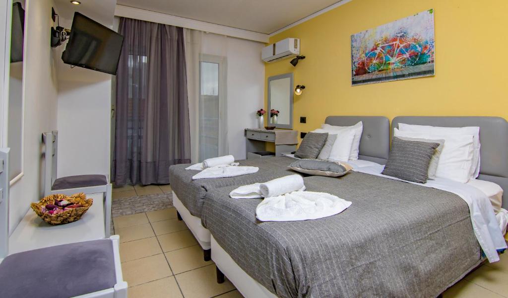 Postel nebo postele na pokoji v ubytování Kahlua Hotel Apartments
