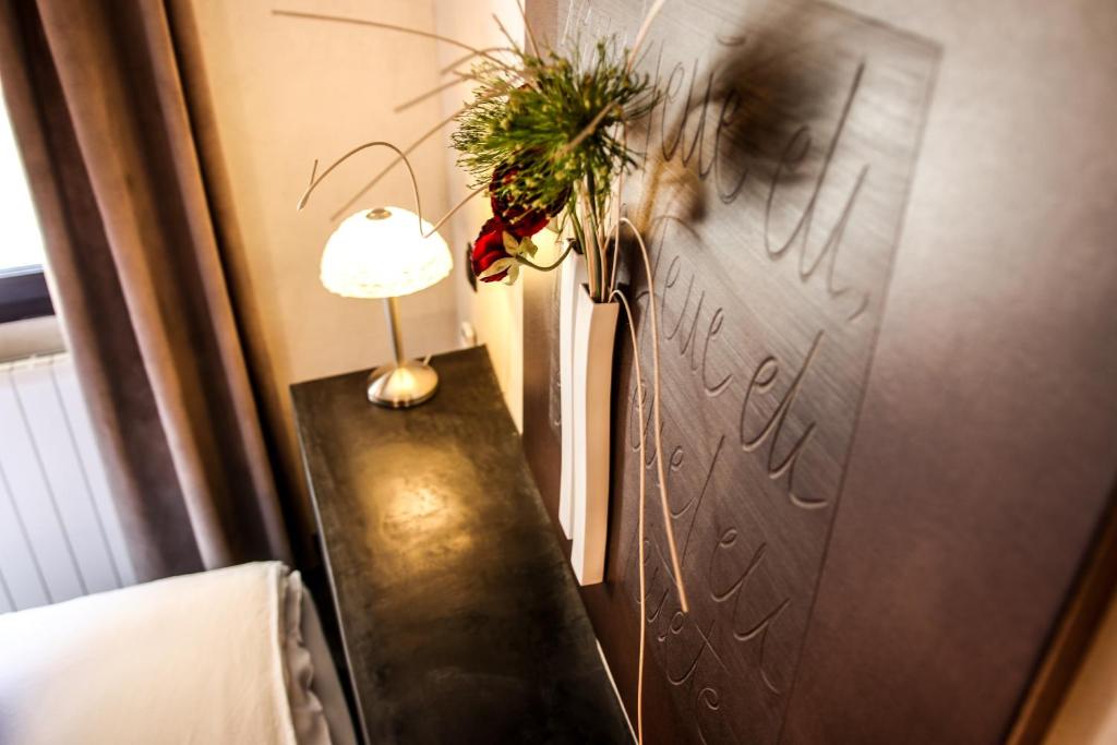 Postel nebo postele na pokoji v ubytování Le Mas de la Lombarde