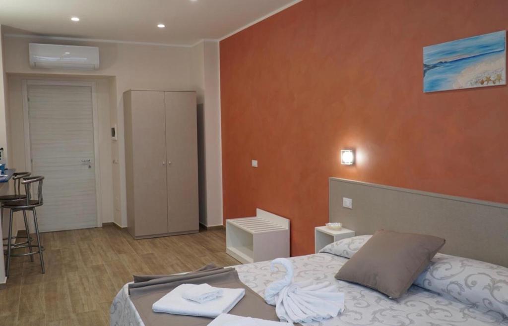 Postel nebo postele na pokoji v ubytování Asterias Residence - Rooms & SPA