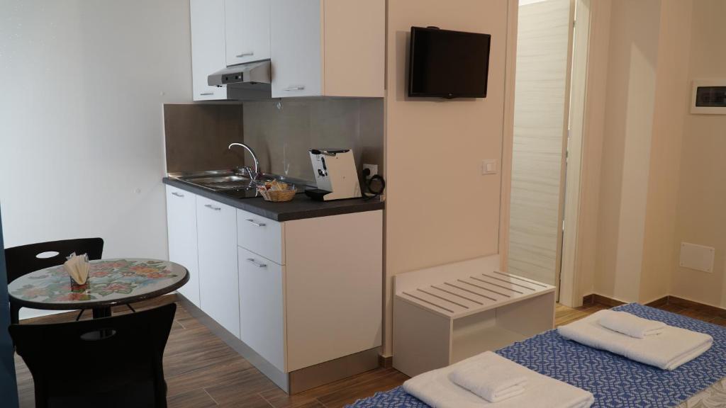 Kuchyň nebo kuchyňský kout v ubytování Asterias Residence - Rooms & SPA