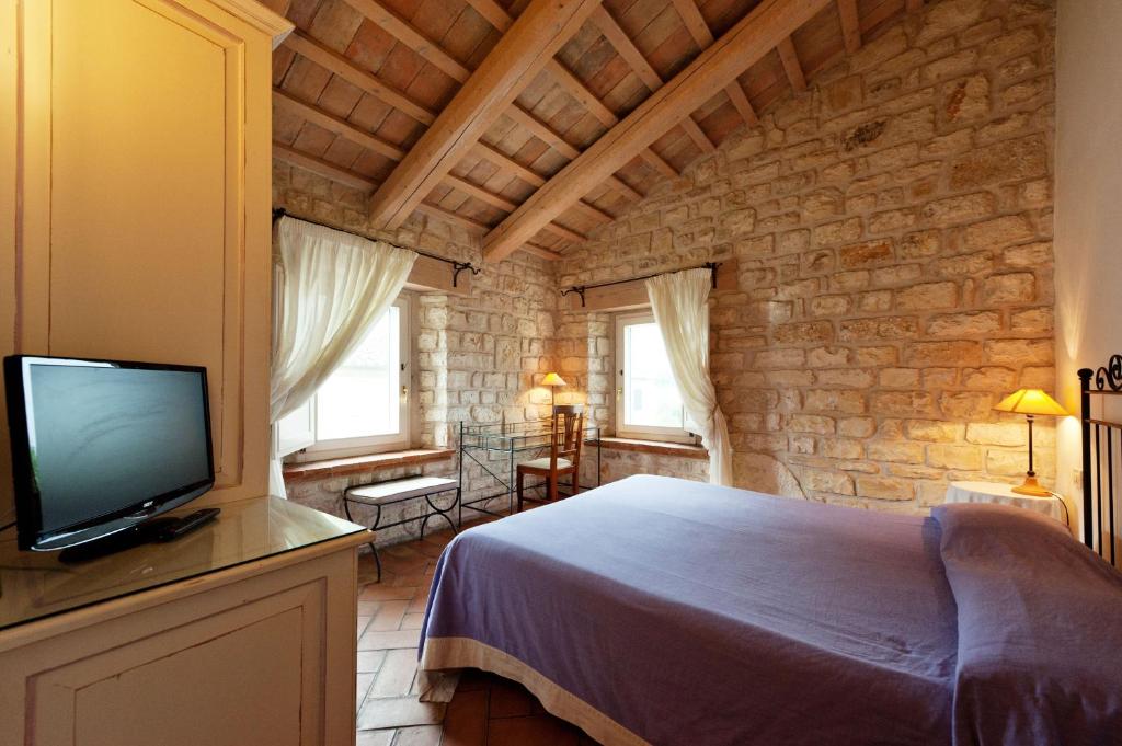 Postel nebo postele na pokoji v ubytování Valcastagno Relais & Residence