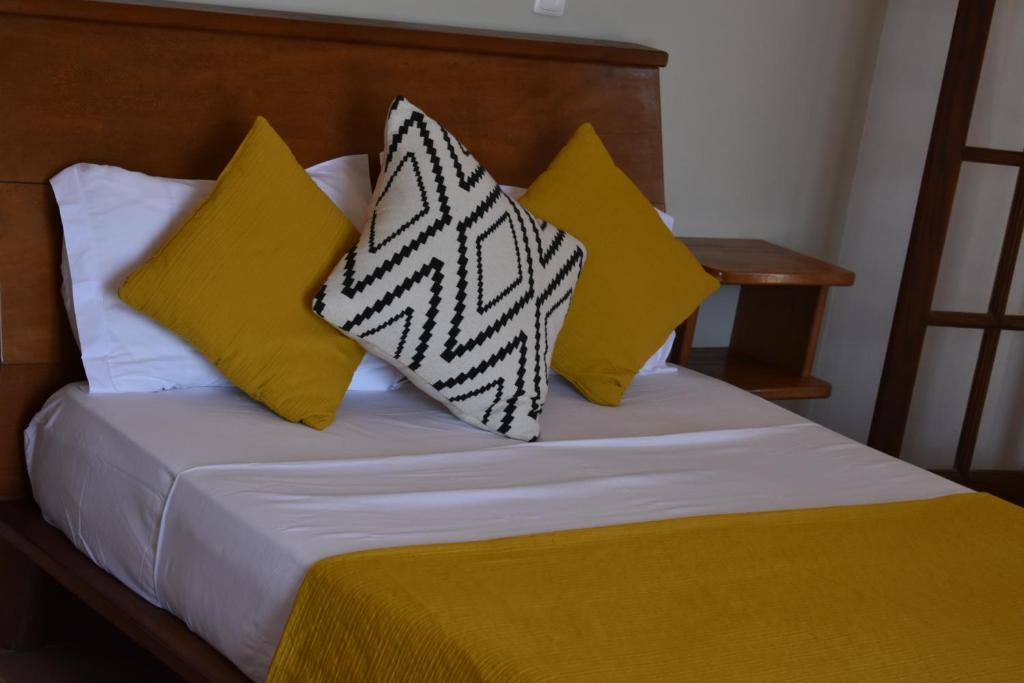 Postel nebo postele na pokoji v ubytování Guest House Orquidea