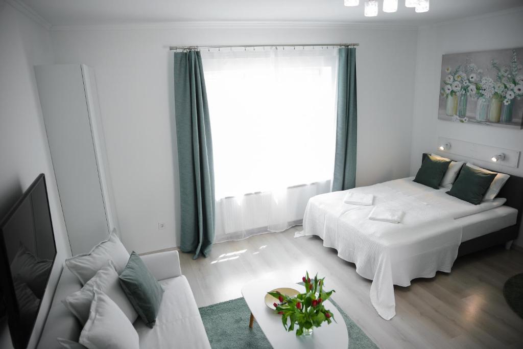 Postel nebo postele na pokoji v ubytování Rába Apartman House