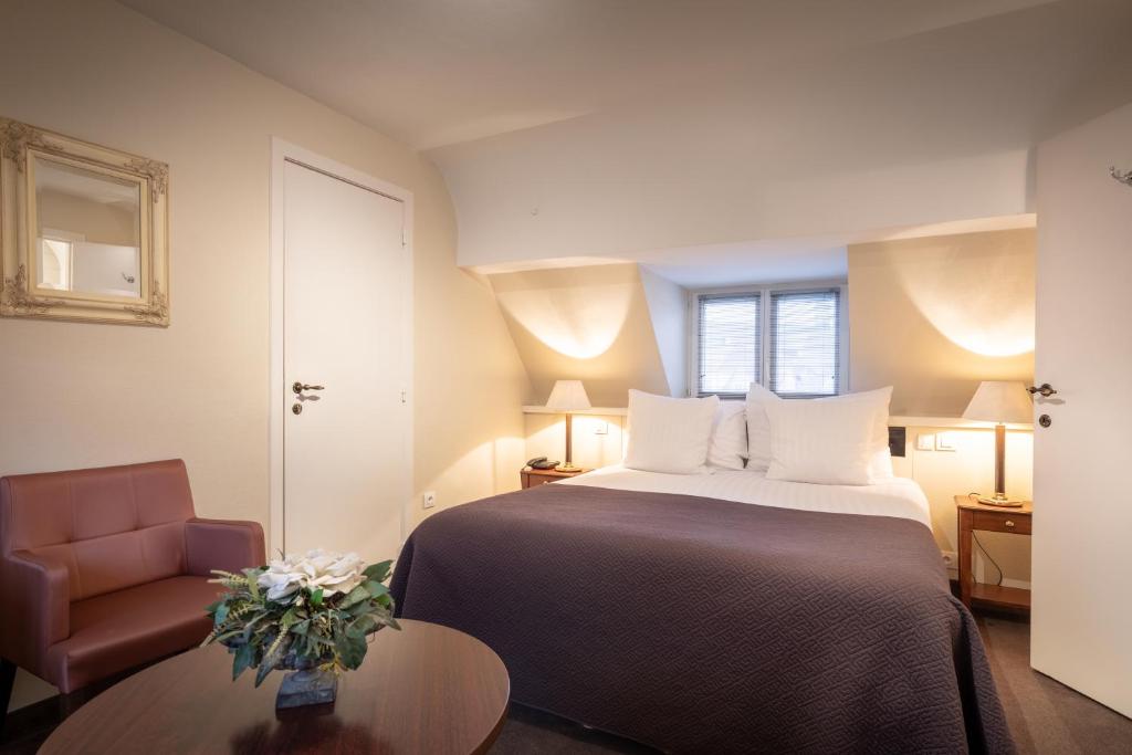 Postel nebo postele na pokoji v ubytování Hotel Albert I