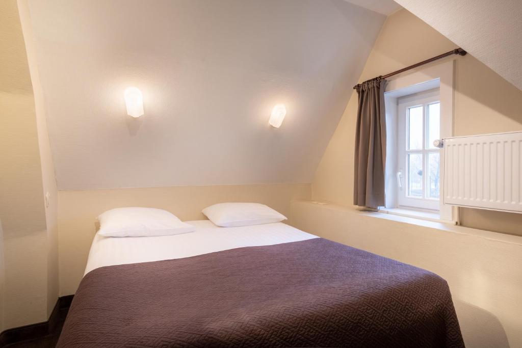 Postel nebo postele na pokoji v ubytování Hotel Albert I
