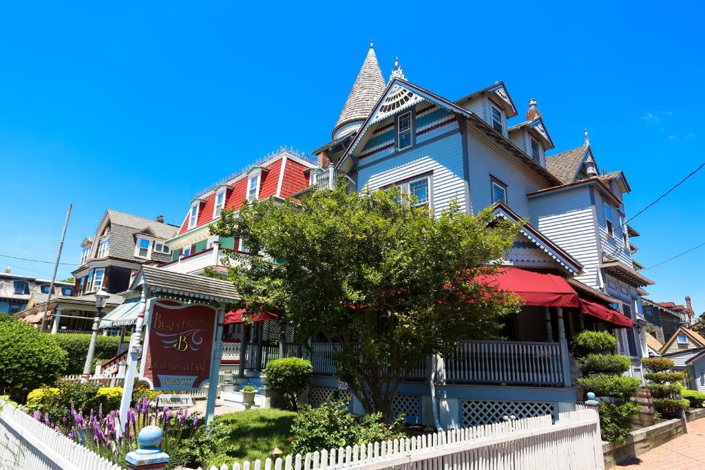 a row of colorful houses on a street at Beauclaires Bed & Breakfast in Cape May