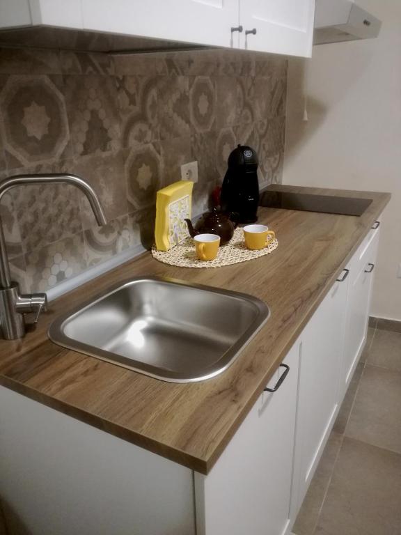Kuchnia lub aneks kuchenny w obiekcie Essentia Rooms- Ortigia Holidays