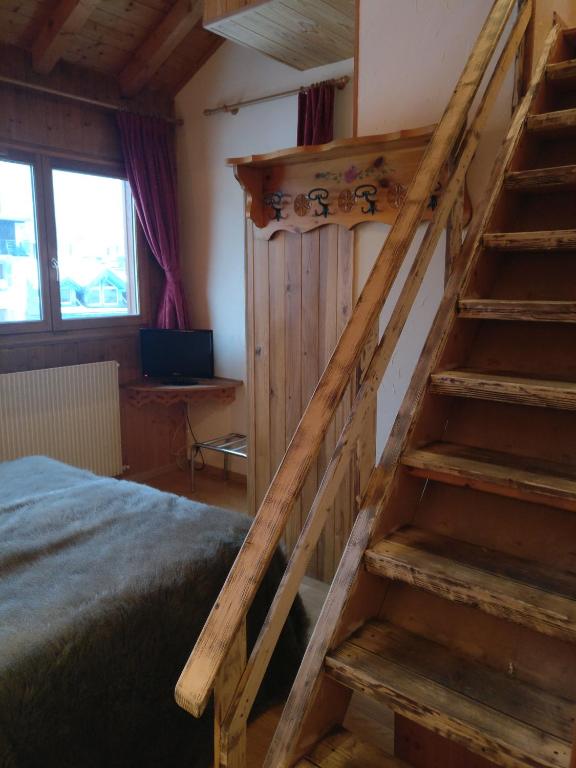 Postel nebo postele na pokoji v ubytování Hôtel Vallée Blanche