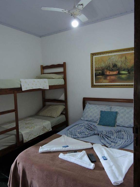 Postel nebo postele na pokoji v ubytování Pousada da Helena Trindade