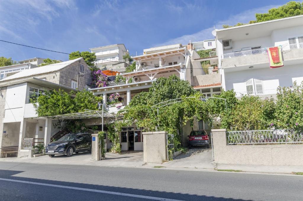 a building on the side of a street at Apartments Zanet in Sumpetar