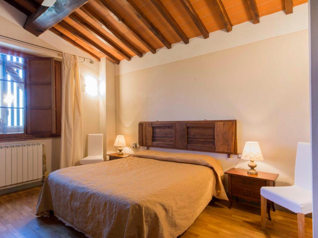 A bed or beds in a room at Apartment Il Borghetto-1 by Interhome