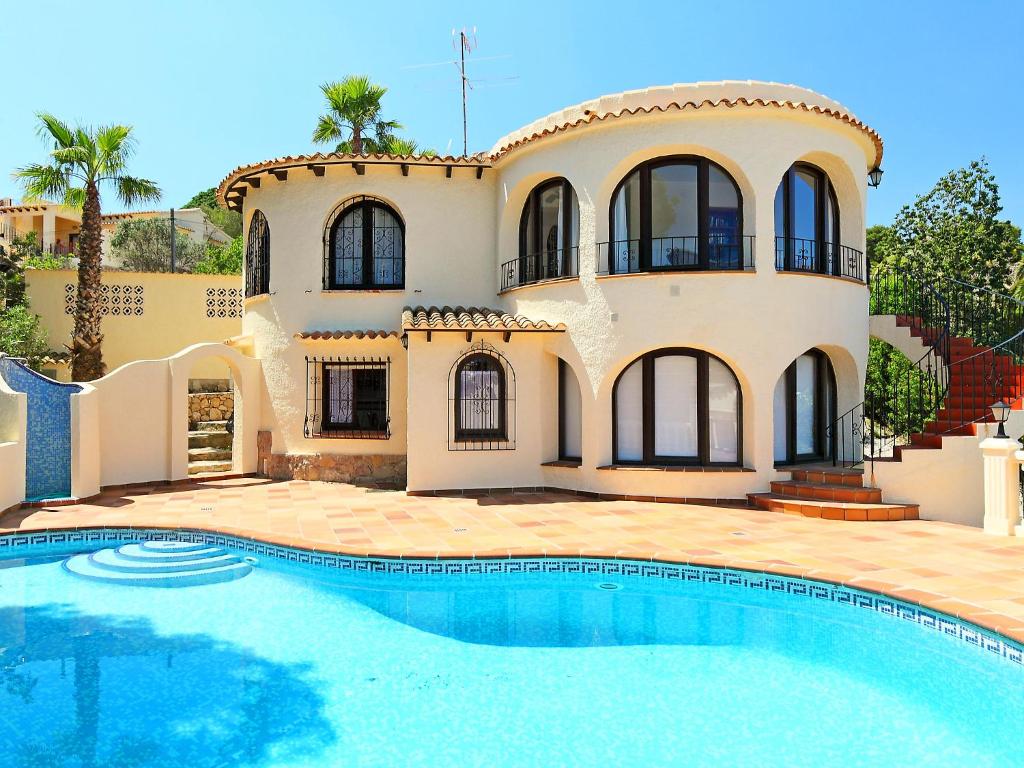 a house with a swimming pool in front of it at Holiday Home Balcon al Mar by Interhome in Balcon del Mar