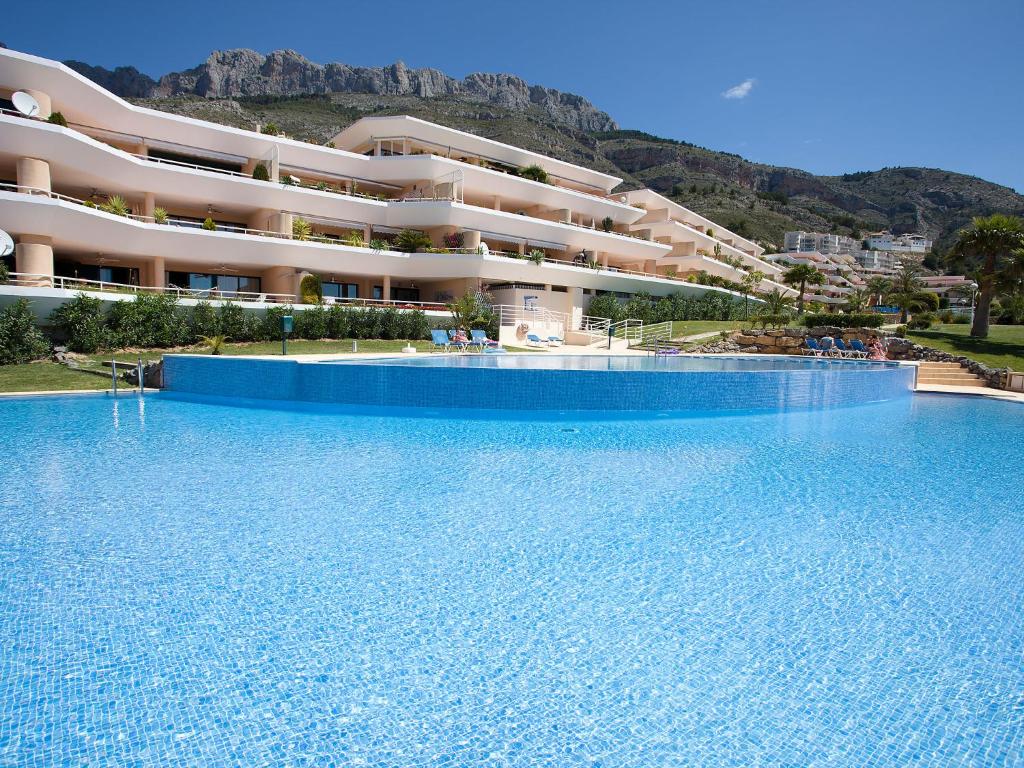 a large swimming pool in front of a building at Apartment Altea La Nova-7 by Interhome in Altea la Vieja