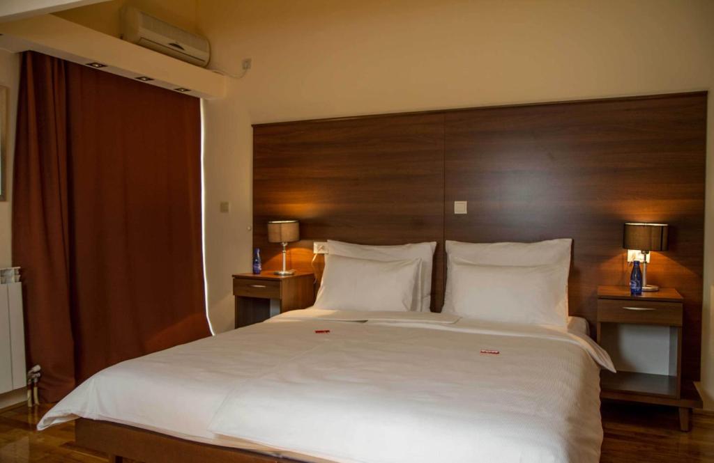 Postel nebo postele na pokoji v ubytování Hotel M