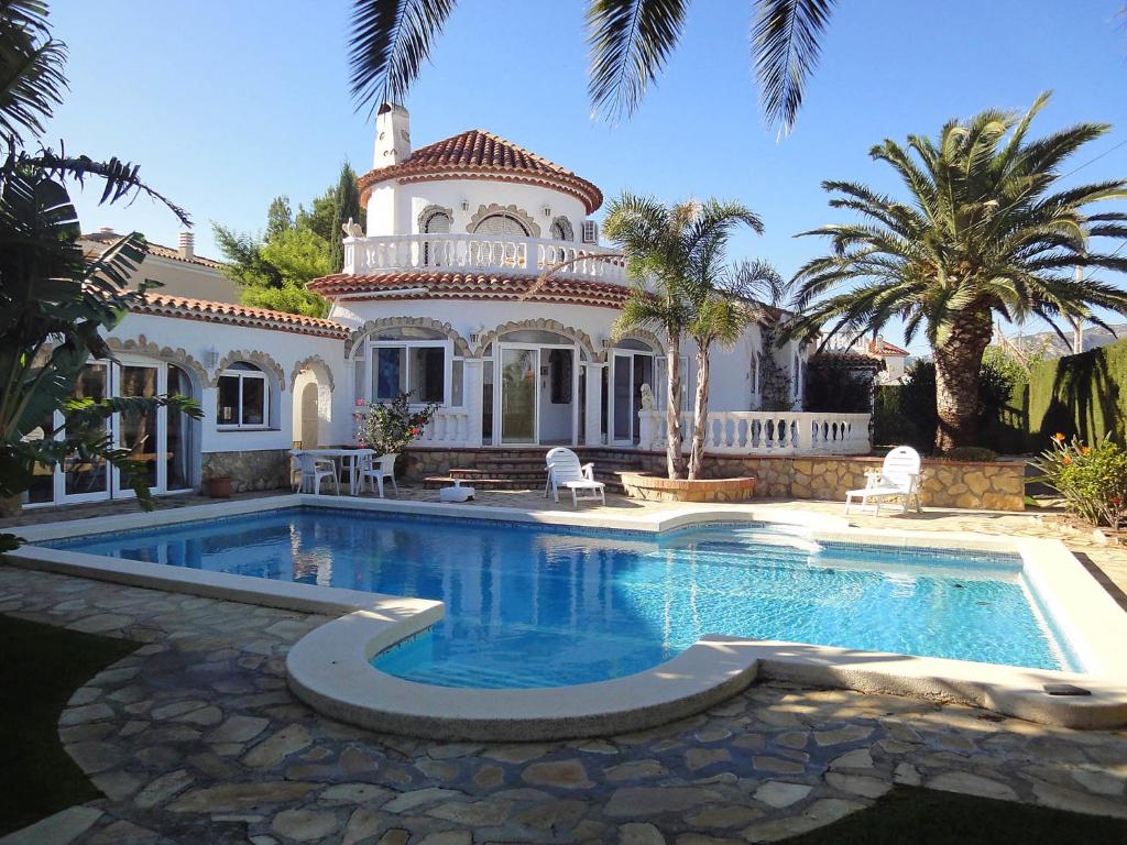 a large house with a swimming pool in front of it at Villa Maria Cristina by Interhome in Miami Platja